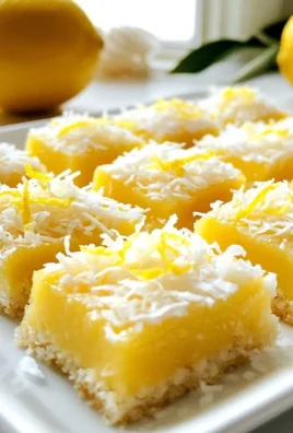 Zesty no-bake lemon coconut squares on a white plate