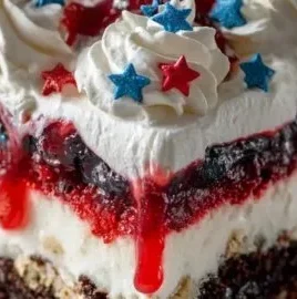 4th of July dessert lasagna with red, white, and blue layers for a festive celebration.