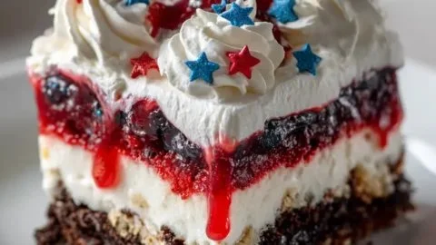 4th of July dessert lasagna with red, white, and blue layers for a festive celebration.