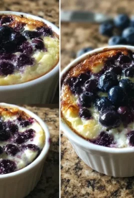 Baked blueberry cottage cheese bowls topped with fresh blueberries and granola.