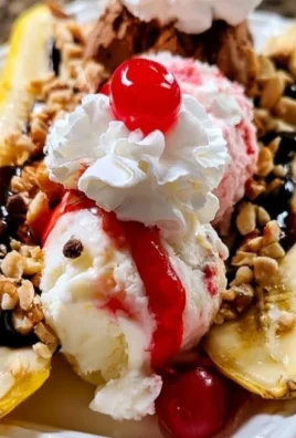 Delicious banana split with ice cream, chocolate syrup, and cherries on top.
