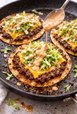Big Mac Tacos served on a plate with toppings and sauces