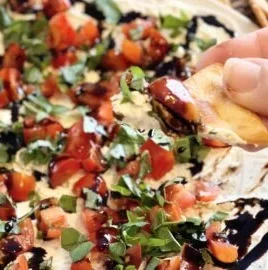 Delicious platter of Bruschetta Dip with fresh ingredients