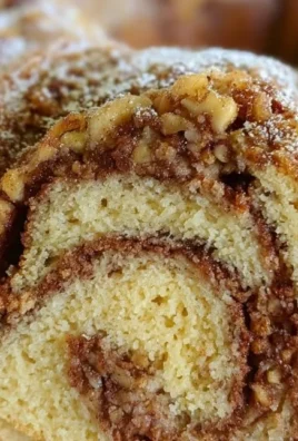Bundt Coffee Cake with Cinnamon Swirl topped with a dusting of sugar