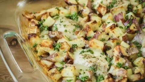 Savory Chicken Potato Bake dish topped with herbs and cheese