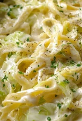 Creamy Alfredo Cabbage Pasta served in a bowl with fresh herbs