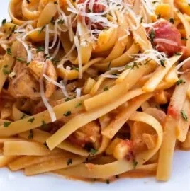 Creamy chipotle chicken pasta dish with vibrant colors and a rich sauce