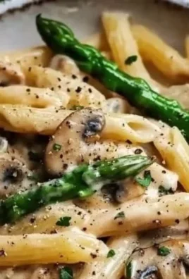 Creamy mushroom and asparagus chicken penne served in a bowl