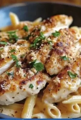 Creamy Parmesan chicken served with penne pasta