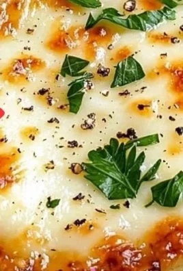 Crispy cheesy cabbage steaks ready to be served on a plate