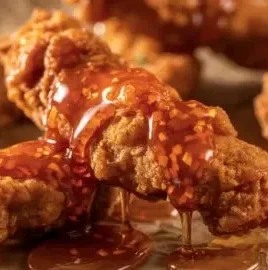 Crispy hot honey chicken tenders served with dipping sauce