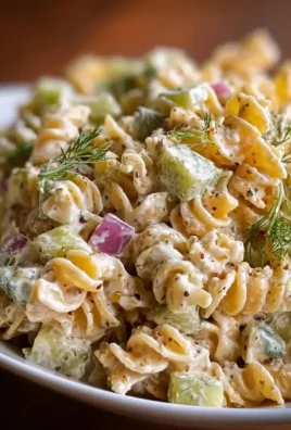 Delicious Dill Pickle Pasta Salad with fresh ingredients in a bowl