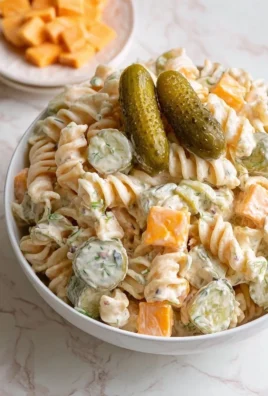 Delicious Dill Pickle Pasta Salad served in a bowl with fresh ingredients