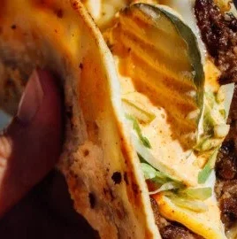 Delicious easy smash burger tacos garnished with fresh toppings