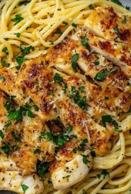 Garlic Butter Chicken Pasta garnished with herbs on a plate