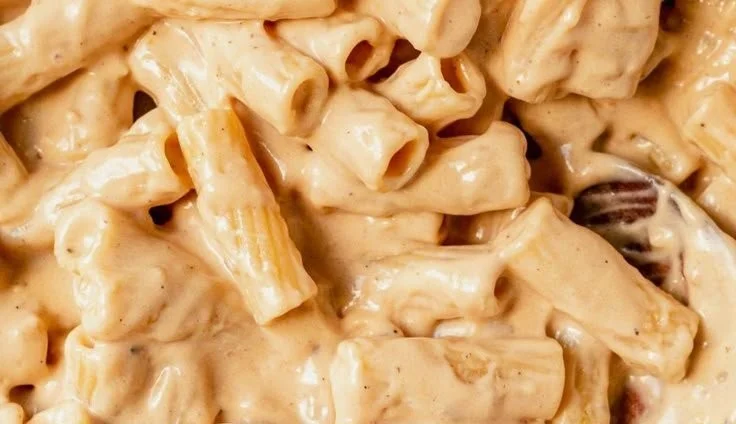 Delicious Garlic Parmesan Chicken Pasta topped with herbs and freshly grated cheese