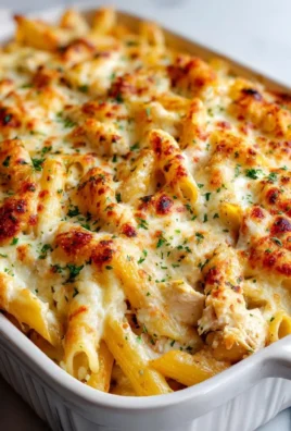 Creamy Garlic Parmesan Chicken Pasta Bake in a casserole dish
