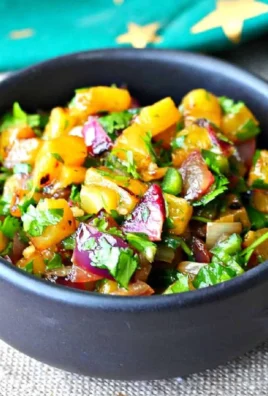 Grilled pineapple and red onion salsa showcasing vibrant colors and fresh ingredients.