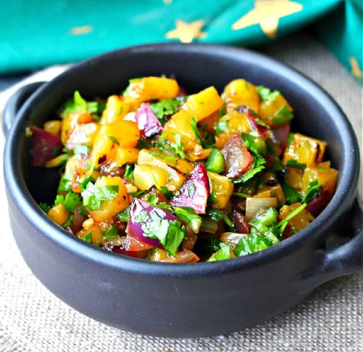 Grilled pineapple and red onion salsa showcasing vibrant colors and fresh ingredients.