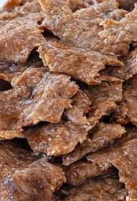 Homemade doner kebab served with fresh vegetables and sauce.