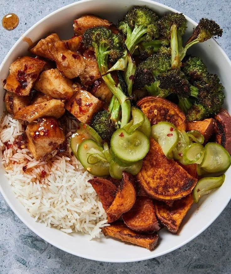 Hot honey chicken bowls with vibrant vegetables and spicy honey drizzle.
