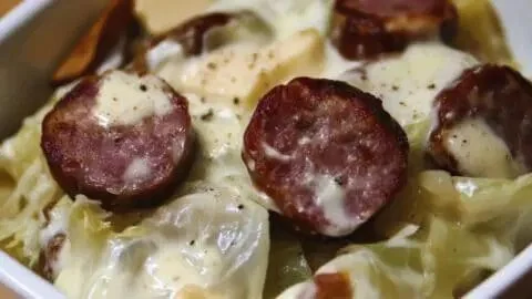 Keto Sausage Cabbage Alfredo dish with creamy sauce and sausage slices