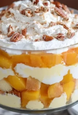 Delicious Peach Trifle layered with fresh peaches and creamy whipped topping