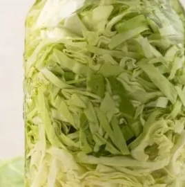 Delicious pickled cabbage in a jar, showcasing vibrant colors and texture.