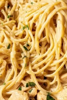 Delicious quick garlic chicken pasta served in a bowl with fresh herbs