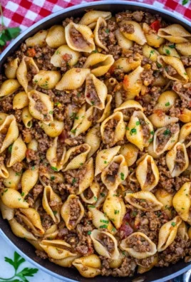 Delicious taco pasta dish topped with cheese and herbs