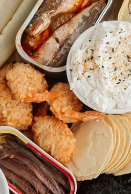 Tinned fish charcuterie board with various seafood selections and accompaniments.