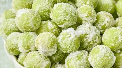 Plate of 3-ingredient frozen candied grapes ready to serve