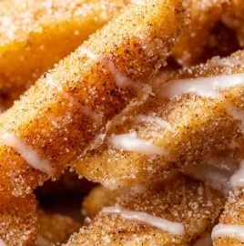 Crispy air fryer apple fries served in a bowl with a caramel dip