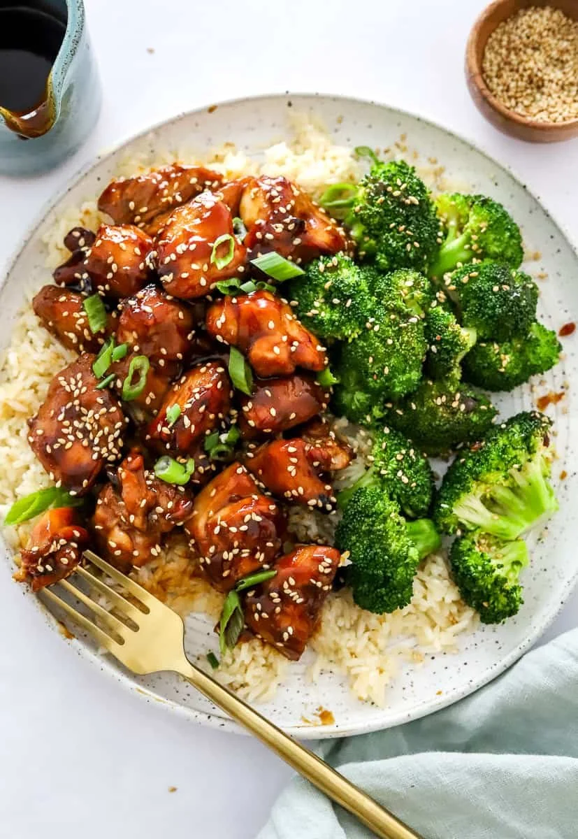Delicious Air Fryer Teriyaki Chicken garnished with sesame seeds and green onions.