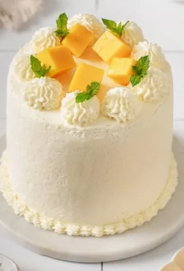 Asian bakery-style mango cake topped with fresh mango slices
