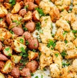 Baked Garlic Parmesan Chicken with seasoned potatoes on a plate