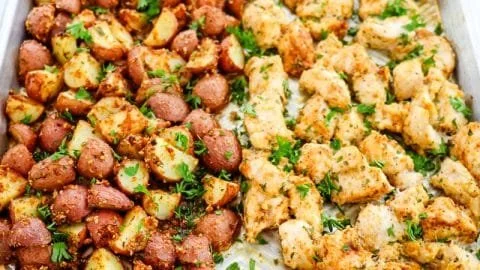 Baked Garlic Parmesan Chicken with seasoned potatoes on a plate