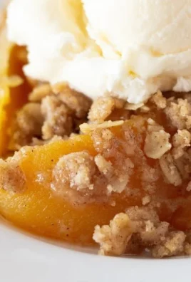 Delicious canned peach crisp topped with oatmeal and brown sugar