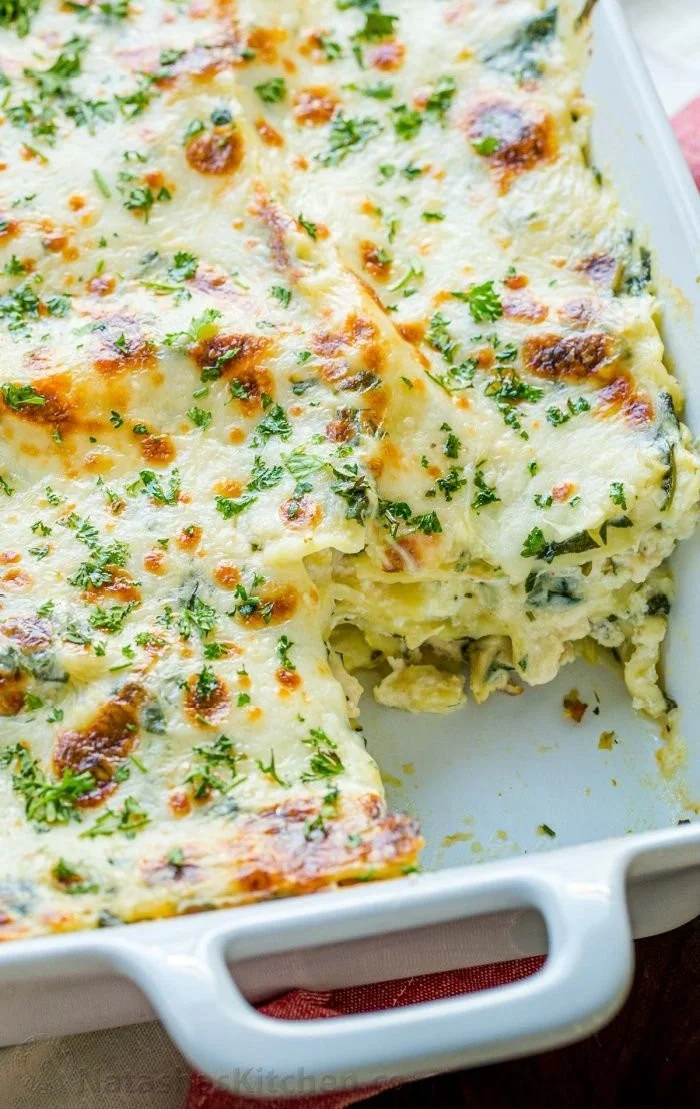 A delicious plate of cheesy chicken lasagna layered with creamy sauce and melted cheese.