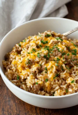 Cheesy Ground Beef and Rice Casserole baked and served in a dish