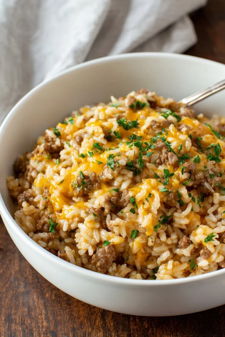 Cheesy Ground Beef and Rice Casserole baked and served in a dish