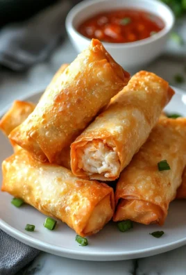 Crispy Crab Rangoon Egg Rolls filled with creamy crab and served with dipping sauce