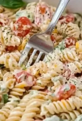 Creamy Italian pasta salad with fresh vegetables and herbs