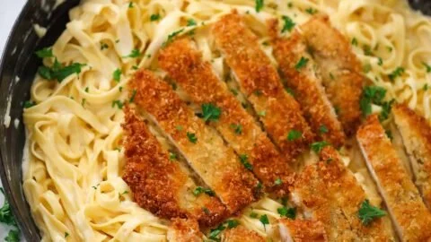 Delicious crispy chicken fettuccine Alfredo served on a plate