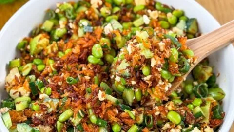Crispy Rice Salad with fresh vegetables and herbs in a vibrant bowl