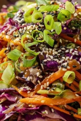 Bowl of Crunchy Asian Cabbage Salad with fresh vegetables and sesame dressing