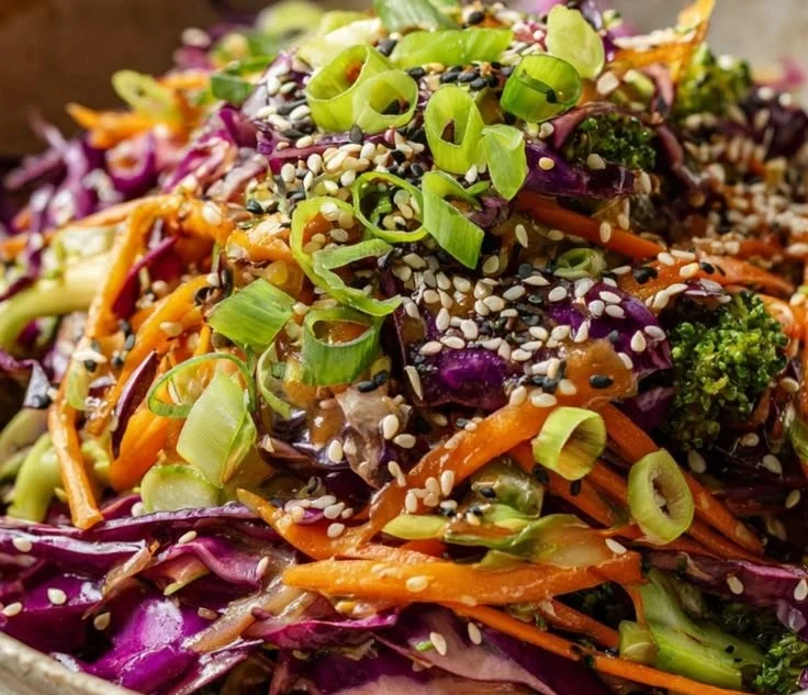 Bowl of Crunchy Asian Cabbage Salad with fresh vegetables and sesame dressing
