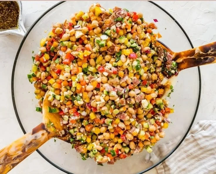 Delicious dense bean salad with a variety of beans and fresh vegetables