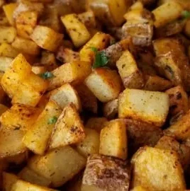 Plate of easy breakfast potatoes with herbs and spices