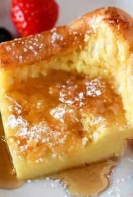 Fluffy easy German pancakes served with syrup and fruit